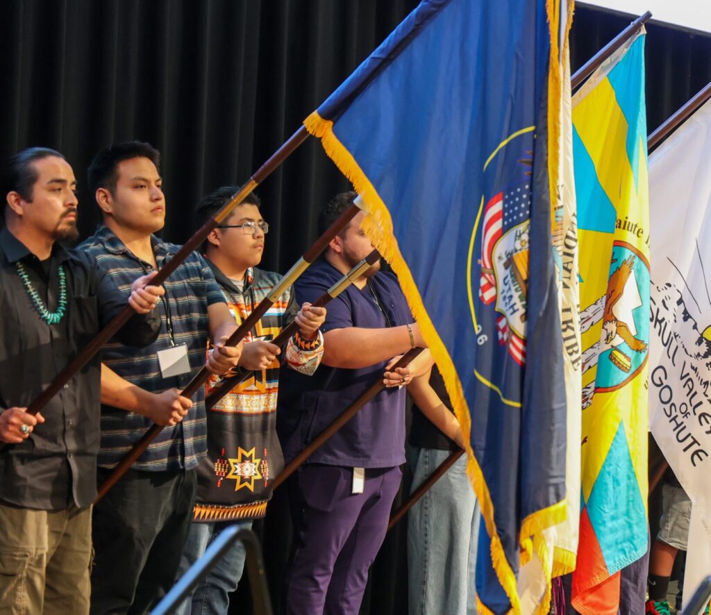 Native Americans holding flags